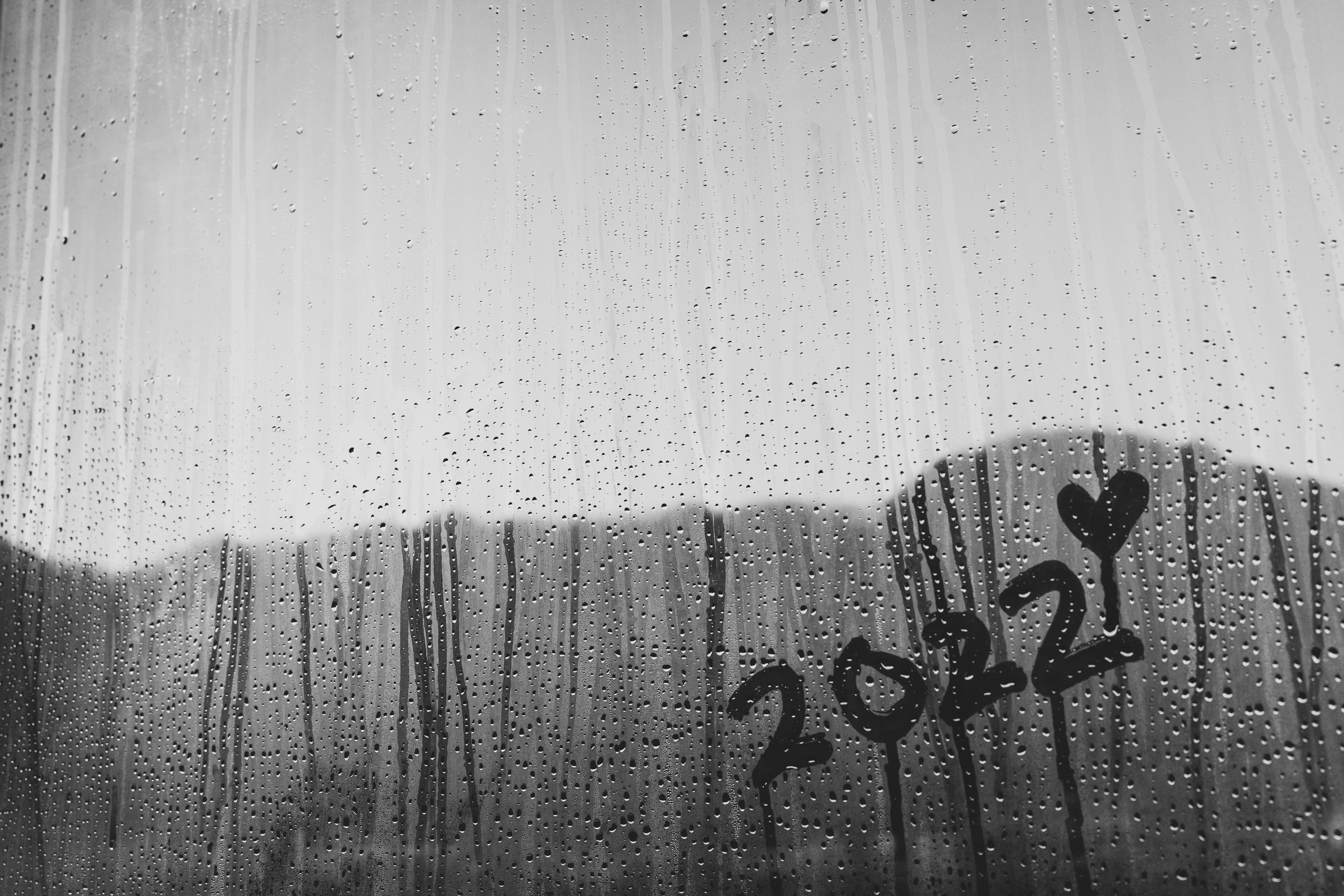 fog on window with 2022 and heart drawn in the fog